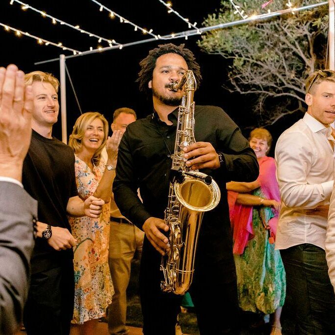 Saxophonist performing with Miss Day at a wedding